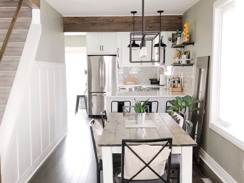 Wooden dining table in newly renovated kitchen.