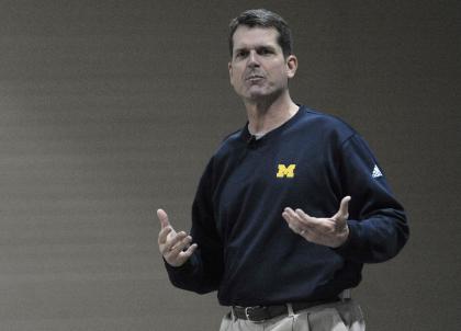 No school went bigger than Michigan, which poached Jim Harbaugh from the NFL. (AP)