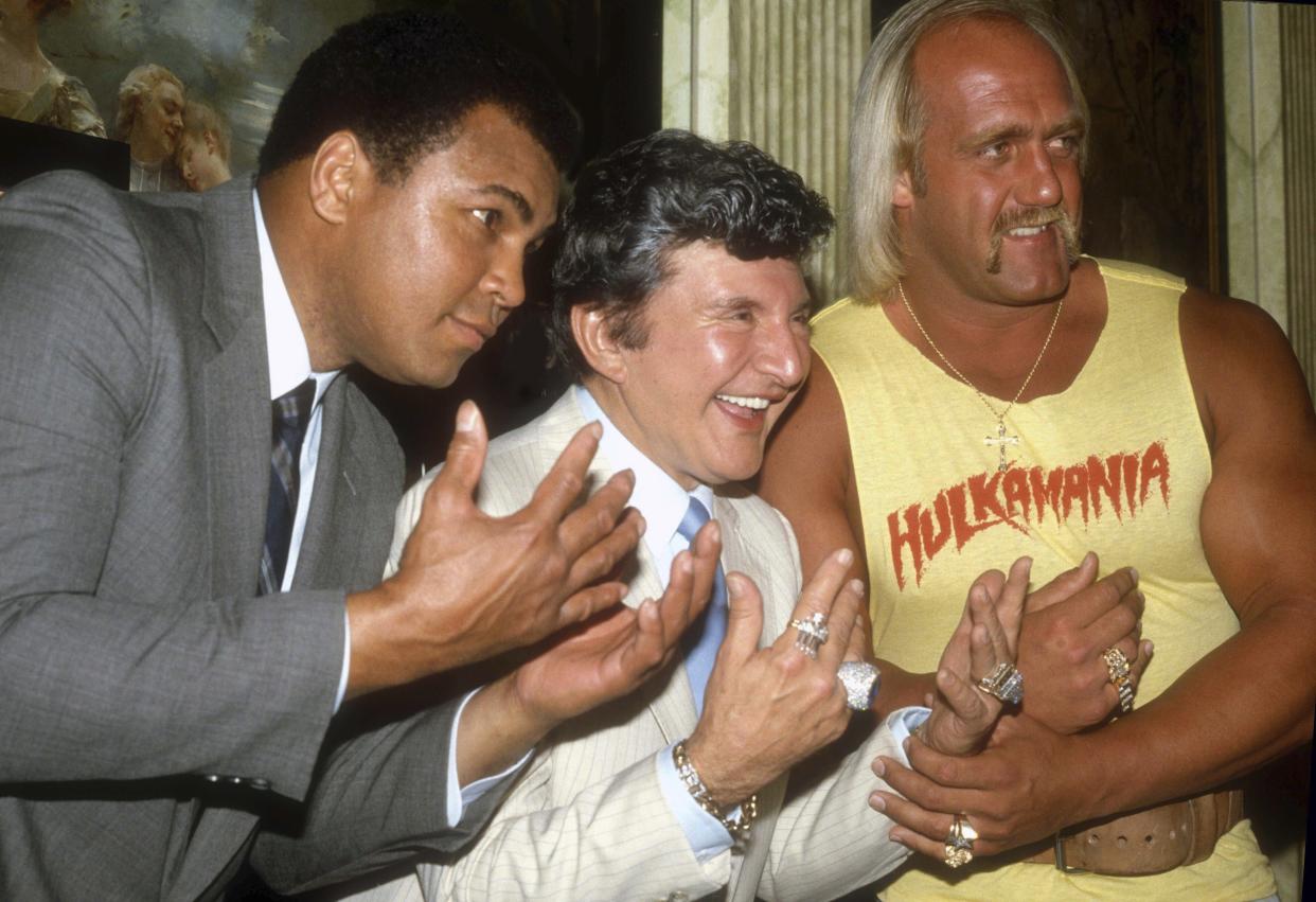 Muhammad Ali, Liberace and Hulk Hogan at Madison Square Garden during a press conference for upcoming WrestleMania I on March 29, 1985. Photo By Adam Scull/PHOTOlink.net/MediaPunch /IPX