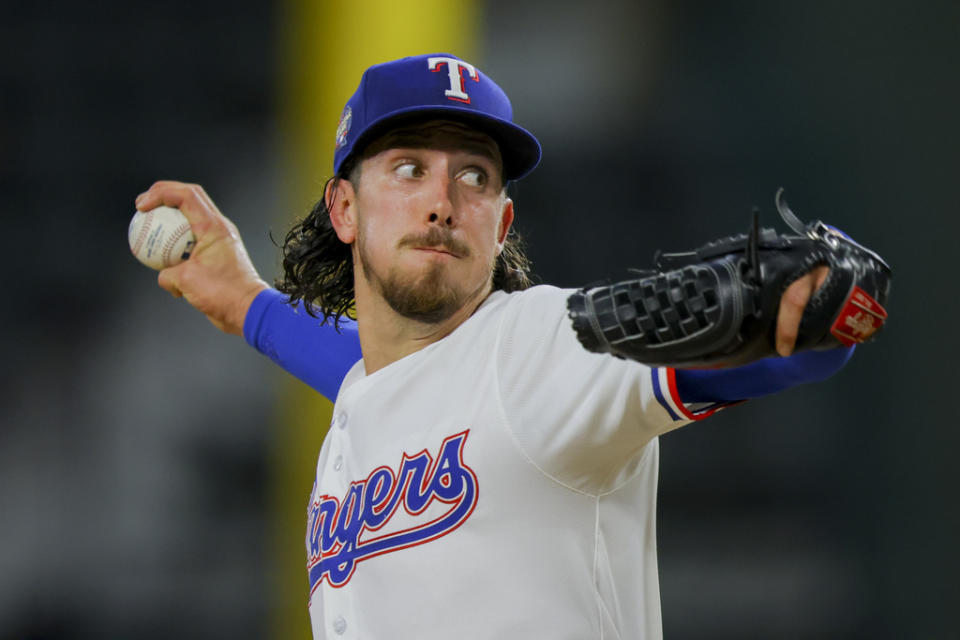 Texas Rangers starting pitcher <a class="link " href="https://sports.yahoo.com/mlb/players/9949/" data-i13n="sec:content-canvas;subsec:anchor_text;elm:context_link" data-ylk="slk:Michael Lorenzen;sec:content-canvas;subsec:anchor_text;elm:context_link;itc:0">Michael Lorenzen</a> delivers during the second inning of a baseball game against the Cleveland Guardians, Monday, May 13, 2024, in Arlington, Texas. (AP Photo/Gareth Patterson)