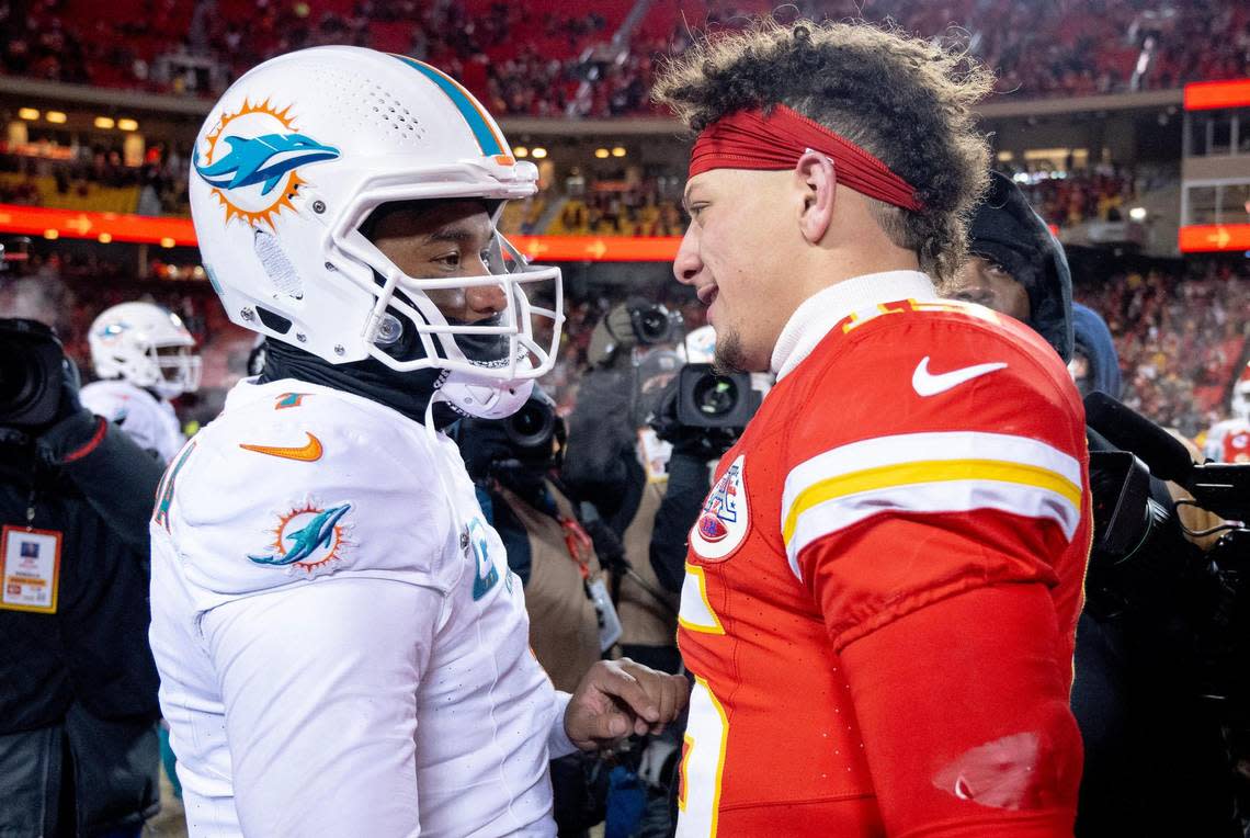 Kansas City Chiefs quarterback Patrick Mahomes (15) meets with Miami Dolphins quarterback Tua Tagovailoa (1) after the Chiefs defeated the Dolphins 26-7 in an AFC Wild Card game at GEHA Field at Arrowhead Stadium on Saturday, Jan. 13, 2024, in Kansas City.