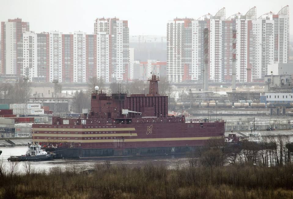 FILE - In this Saturday, April 28, 2018 file photo, the floating nuclear power plant, the 'Akademik Lomonosov', is towed out of the St. Petersburg shipyard where it was constructed in St. Petersburg, Russia. The Akademik Lomonosov that carries two 35-megawatt nuclear reactors set out Friday Aug. 23, 2019, from the Arctic port of Murmansk on the Kola Peninsula on a three-week journey to Pevek on the Chukotka Peninsula. (AP Photo/Dmitri Lovetsky, File)