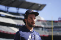 Atlanta Braves shortstop Dansby Swanson walks off the field after a workout ahead of baseballs National League Championship Series against the Los Angeles Dodgers, Friday, Oct. 15, 2021, in Atlanta. (AP Photo/Brynn Anderson)
