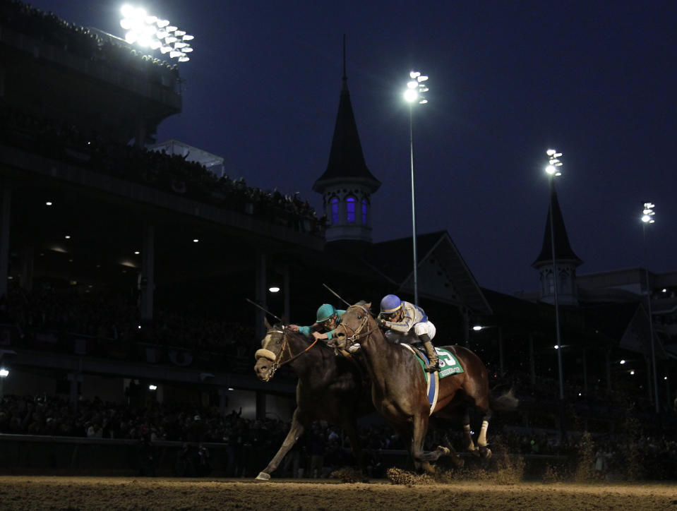 FILE - In this Nov. 6, 2010, file photo, jockey Garrett Gomez, right, rides Blame to victory in the Breeder's Cup Classic horse race at Churchill Downs in Louisville, Ky. Gomez, who won nearly 4,000 races in a 25-year career and was among the greatest jockeys of the first decade of the 21st century, has died in southern Arizona. He was 44. Authorities with the Pascua Yaqui Tribe said Thursday, Dec. 15, 2016, that Gomez was found unconscious on the floor of a hotel room Wednesday and pronounced dead at the scene. They say foul play isn't suspected (AP Photo/David J. Phillip, File)