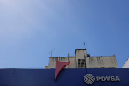 FILE PHOTO: The corporate logo of the Venezuelan state-owned oil company PDVSA is seen at a gas station in Caracas, Venezuela November 2, 2018. REUTERS/Marco Bello/File Photo