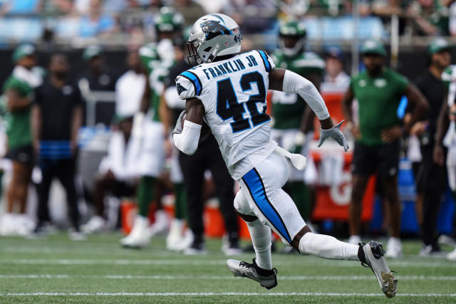 CHARLOTTE, NC - AUGUST 12: Sam Franklin Jr. 42 of the Carolina Panthers  attempts to tackle EJ