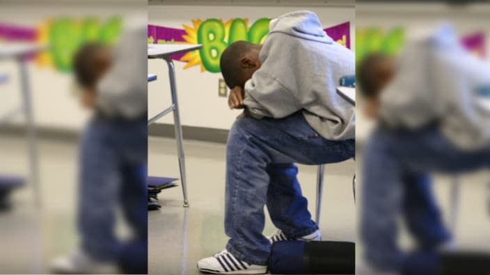 Black student sad in classroom x theGrio.com