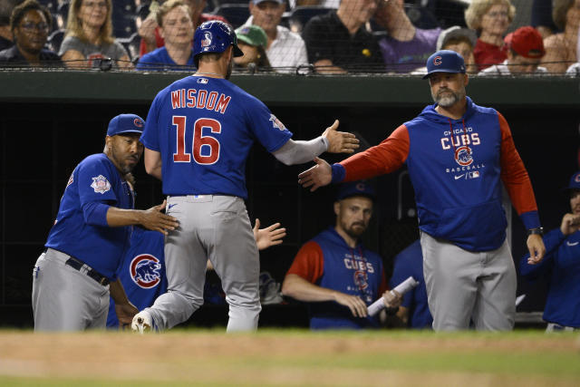 Patrick Wisdom of the Chicago Cubs in the dugout while playing the