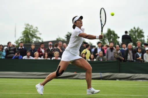 China's Li Na pictured at the Wimbledon tennis tournament in south-west London on June 27. China has announced a team of 396 athletes for the London Olympics, including tennis superstar Li, who won China's first Grand Slam title at last year's French Open