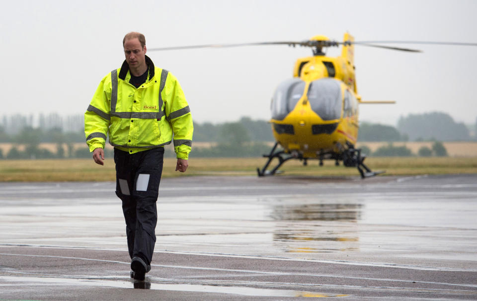 CAMBRIDGE , UNITED KINGDOM - JULY 13: Prince William, The Duke of Cambridge as he begins his new job with the East Anglian Air Ambulance (EAAA) at Cambridge Airport on July 13, 2015 in Cambridge, England. The former RAF search and rescue helicopter pilot will work as a co-pilot transporting patients to hospital from emergencies ranging from road accidents to heart attacks. (Photo by Stefan Rousseau WPA - Pool/Getty Images)