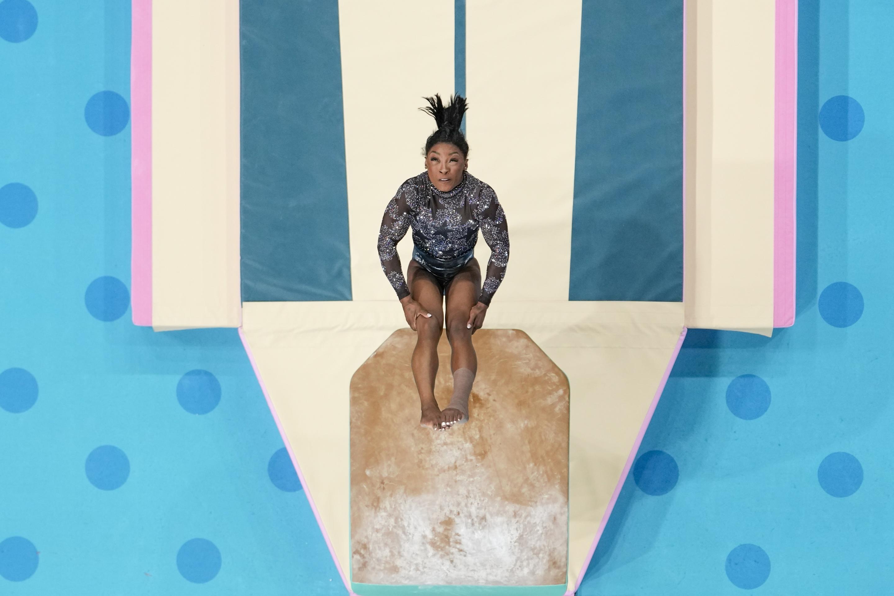 Simone Biles, of United States, performs on the vault during a women's artistic gymnastics qualification round.