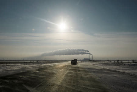 Cars drive on a road toward Eurasian Resources Group's (ERG) Aksu Power Plant on outskirts of the town of Aksu, north-eastern Kazakhstan, February 22, 2018. REUTERS/Shamil Zhumatov