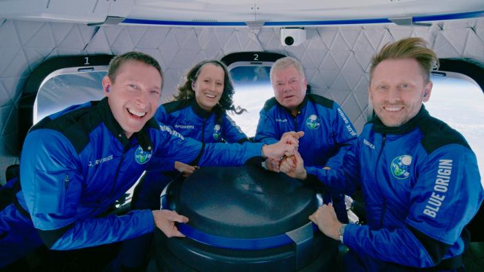 This photo provided by Blue Origin shows Blue Origin&#39;s New Shepard rocket space passengers from left, Glen de Vries, Audrey Powers, William Shatner, and Chris Boshuizen pose inside the capsule on Wednesday, Oct. 13, 2021.  The &#x00201c;Star Trek&#x00201d; actor and three fellow passengers hurtled to an altitude of 66.5 miles (107 kilometers) over the West Texas desert in the fully automated capsule, then safely parachuted back to Earth in a flight that lasted just over 10 minutes.  (Blue Origin via AP) ORG XMIT: NY750
