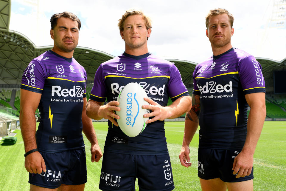 MELBOURNE, AUSTRALIA - FEBRUARY 07: Vice-captain Jahrome Hughes, captain Harry Grant and vice-captain Cameron Munster of the Storm pose during a Melbourne Storm NRL captaincy announcement at AAMI Park on February 07, 2024 in Melbourne, Australia. (Photo by Josh Chadwick/Getty Images)