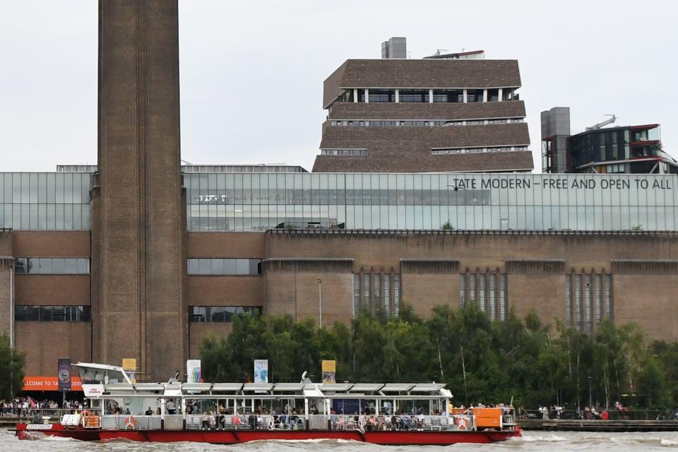 A general view shows the Tate Modern gallery with its viewing platform rising above and behind the main building (C) on the southern bank of the River Thames in London on August 4, 2019 after it was put on lock down and evacuated after an incident involving a child falling from height and being airlifted to hospital. - London's Tate Modern gallery was evacuated on Sunday after a child fell "from a height" and was airlifted to hospital. A teenager was arrested over the incident, police said, without giving any details of the child's condition. (Photo by Daniel SORABJI / AFP)        (Photo credit should read DANIEL SORABJI/AFP/Getty Images)