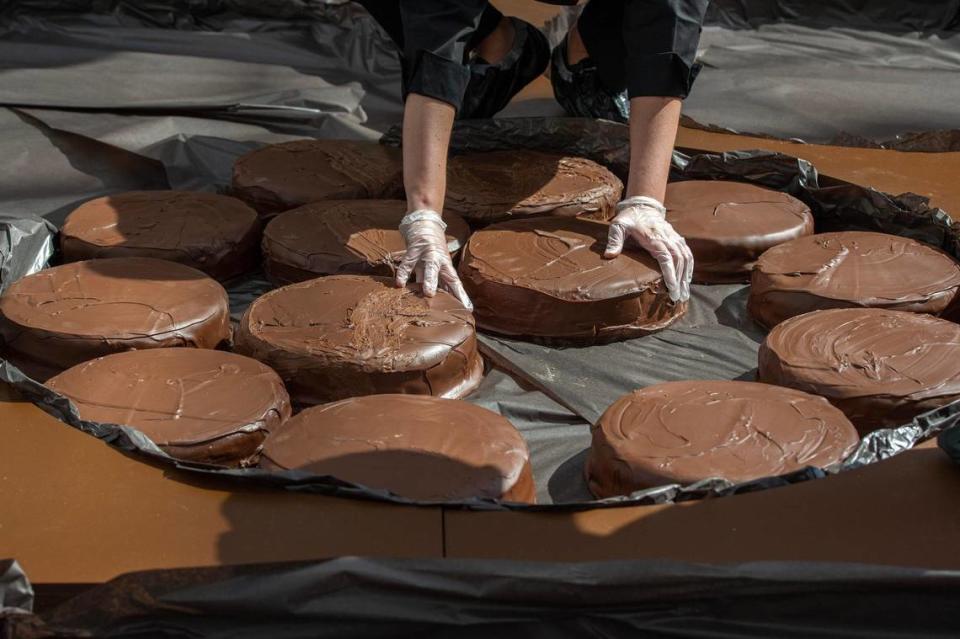 Giant specialty chocolates weighing from 11 to 38 pounds each are placed in the enormous gift box that measured 30 feet, 4.5 inches by 15 feet, five inches.