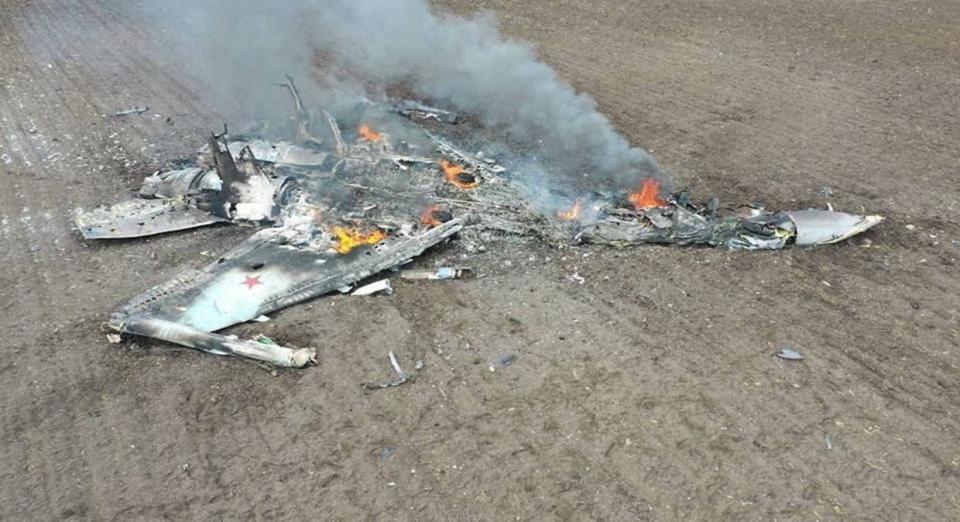 The smoking debris of a Russian Su-35 fighter jet that crashed in a field in Ukraine.