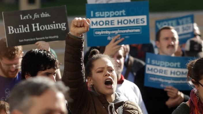 Housing advocates protest at a rally in January 2020 outside of city hall in Oakland, California. Voters will soon decide whether to permit the construction of more affordable housing in the city. (Photo: Jeff Chiu/AP, File)