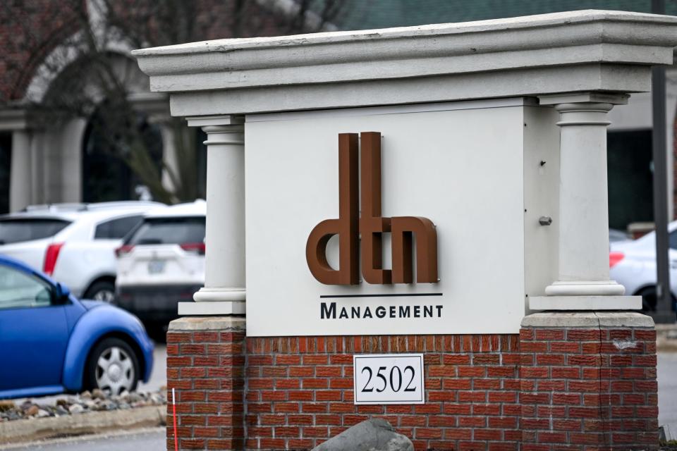 A sign outside DTN Management's office on Wednesday, Jan. 11, 2023, in Lansing.
