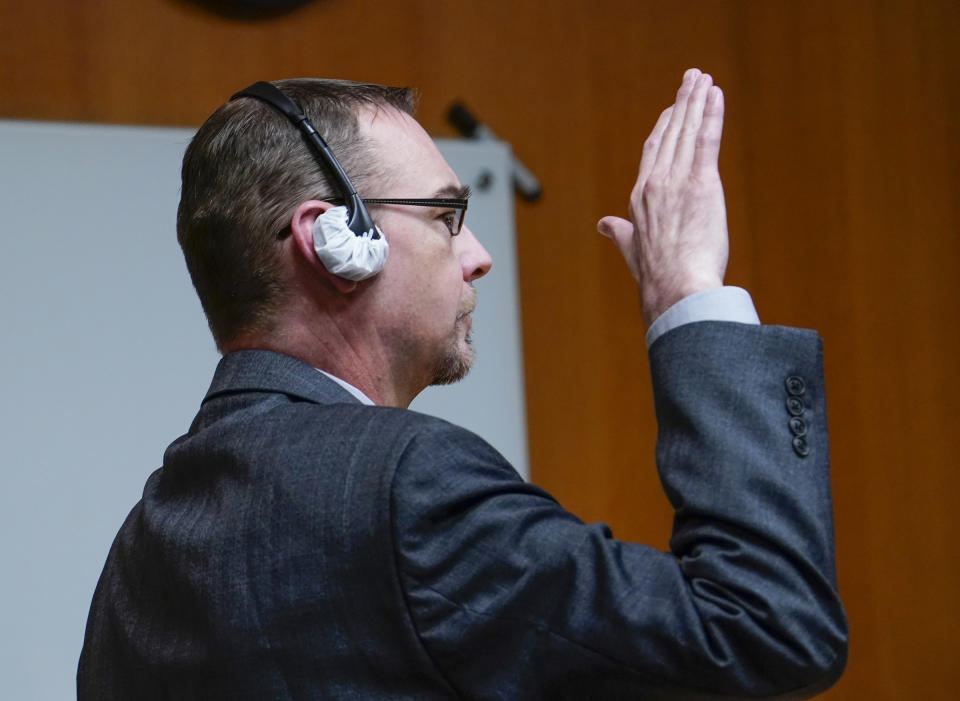 James Crumbley raises his right hand to swear he aware of his rights and has chosen not to testify in his case in the Oakland County Courtroom of Cheryl Matthews on Wednesday, March, 13, 2024 in Pontiac, Mich. Crumbley is charged with involuntary manslaughter, accused of failing to secure a gun at home and ignoring his son's mental health. Ethan Crumbley killed four students at Oxford High School in 2021. (Mandi Wright/Detroit Free Press via AP, Pool)