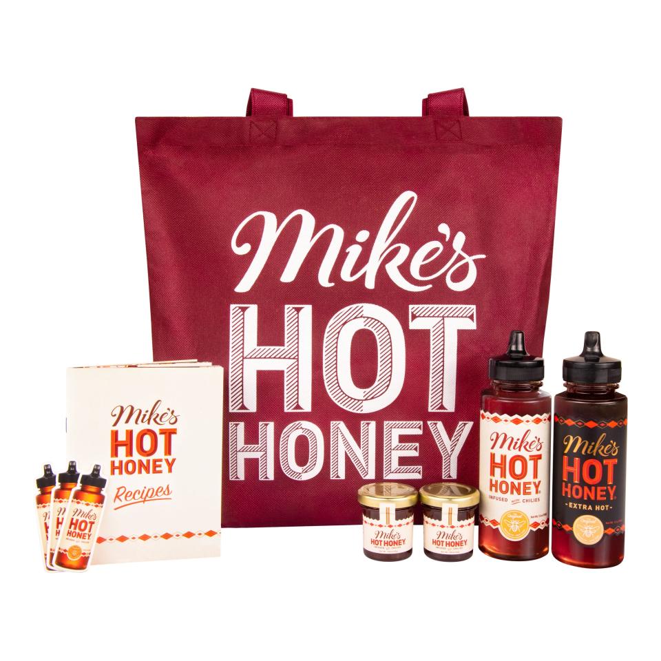 <p><a href="https://mikeshothoney.com/products/mikes-hot-honey-gift-set?variant=42032050340085%C2%A4cy%3DUSD" rel="nofollow noopener" target="_blank" data-ylk="slk:Shop Now;elm:context_link;itc:0;sec:content-canvas" class="link ">Shop Now</a></p><p>Mike's Hot Honey Gift Set</p><p>mikeshothoney.com</p><p>$28.99</p>