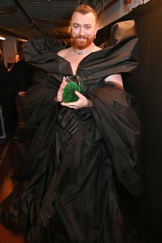 <p>Dave Benett/Getty</p> Sam Smith poses backstage at the British Fashion Awards.