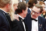 FILE - Actor Helmut Berger, right, speaks with from left, actor Jeremie Renier, actress Aymeline Valade, and director Bertrand Bonello for the screening of Saint-Laurent at the 67th international film festival, Cannes, southern France, Saturday, May 17, 2014. Austrian-born actor Helmut Berger, a European movie star in the 1960s and 1970s who rose to prominence with roles in films by Italian director Luchino Visconti, has died. He was 78. (AP Photo/Alastair Grant, File)