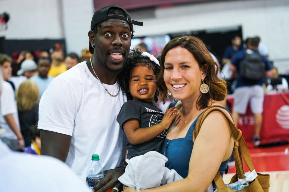 LAS VEGAS, NEVADA - JULY 06: (L-R) Jrue Holiday, daughter J.T. and wife Lauren Holiday smile during the NBA Summer League on July 06, 2019 in Las Vegas, Nevada. (Photo by Cassy Athena/Getty Images)