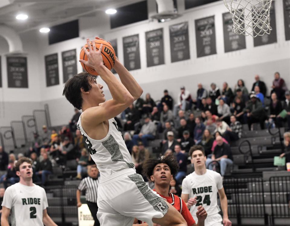 Fossil Ridge boys basketball player Nick Randall goes up for a layup during the SaberCats game against Brighton on Tuesday at Fossil Ridge High School in Fort Collins.