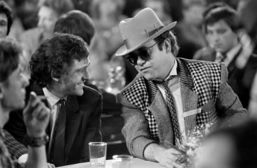 Seen here in Paris in 1984 with top French international Michel Platini, Elton John has always been a huge football fan