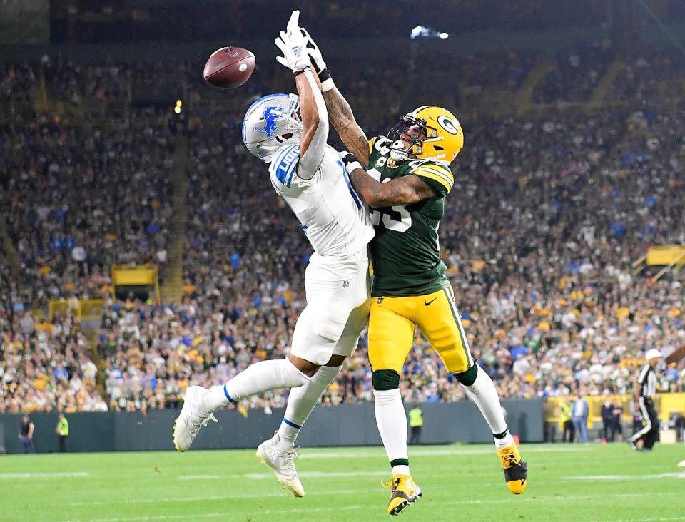 Jaire Alexander of the Green Bay Packers breaks-up a pass against Amon-Ra St. Brown of the Detroit Lions during the first half at Lambeau Field on Sept. 20, 2021, in Green Bay.