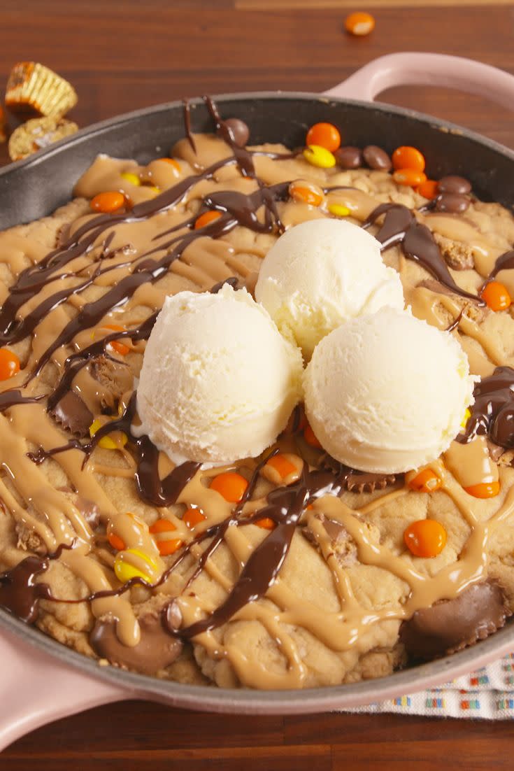 <p>This skillet cookie will warm you right up.</p><p>Get the recipe from <a href="https://www.delish.com/cooking/recipe-ideas/recipes/a57756/giant-reeses-stuffed-cookie-recipe/" rel="nofollow noopener" target="_blank" data-ylk="slk:Delish;elm:context_link;itc:0;sec:content-canvas" class="link ">Delish</a>.<br></p>