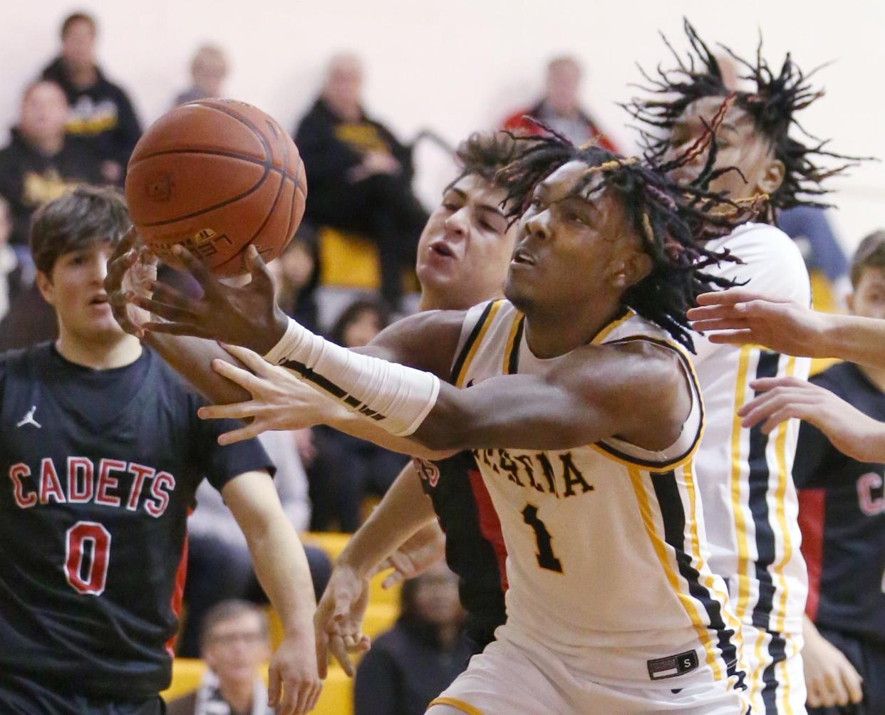 Greece Athena's Khorie Reaves battles for control of a loose ball with Hilton's Luke Pisani under the Athena basket during their Section V boys basketball matchup Thursday, Feb. 16, 2023 at Greece Athena High School.  Hilton won the game 61-54.