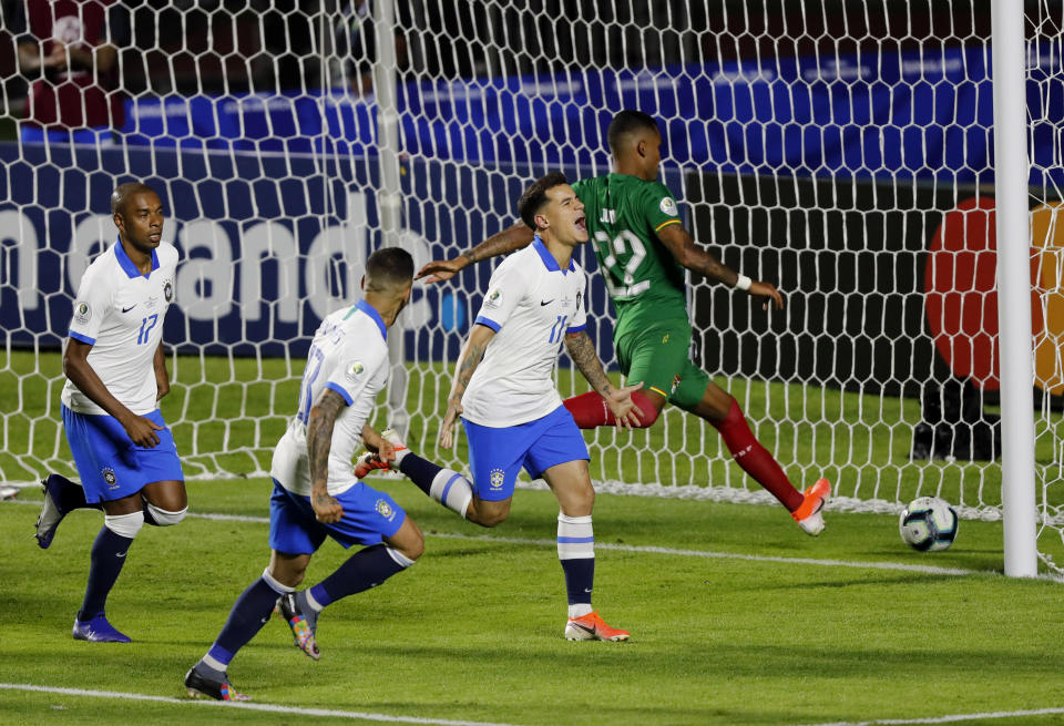 Brazil's Philippe Coutinho, second from right, celebrates scoring his side's first goal against Bolivia during a Copa America Group A soccer match at the Morumbi stadium in Sao Paulo, Brazil, Friday, June 14, 2019. Brazil won 3-0. (AP Photo/Nelson Antoine)