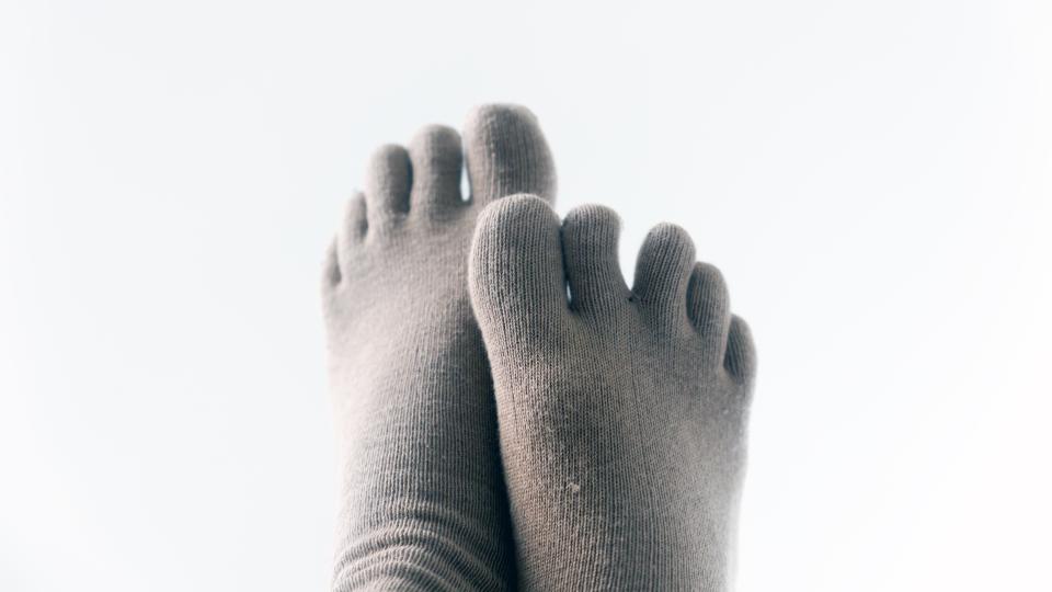 Isolated feet in toe socks