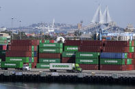 Cargo containers sit stacked at the Port of Los Angeles, Wednesday, Oct. 20, 2021 in San Pedro, Calif. California Gov. Gavin Newsom on Wednesday issued an order that aims to ease bottlenecks at the ports of Los Angeles and Long Beach that have spilled over into neighborhoods where cargo trucks are clogging residential streets. (AP Photo/Ringo H.W. Chiu)