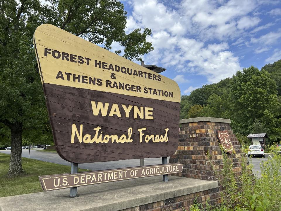 A sign outside of the Wayne National Forest headquarters is posted in Nelsonville, Ohio on Tuesday, August 29, 2023. A vigorous debate is under way over a U.S. Forest Service proposal to rename the 250,000-acre Wayne National Forest after Ohio's state tree, the buckeye. (AP Photo/Patrick Orsagos)