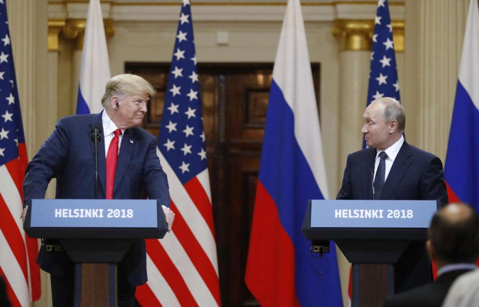 <p>U.S. President Donald Trump, left, looks to Russian President Vladimir Putin during a press conference after the meeting of U.S. President Donald Trump and Russian President Vladimir Putin at the Presidential Palace in Helsinki, Finland, July 16, 2018. (Photo: Alexander Zemlianichenko/AP) </p>