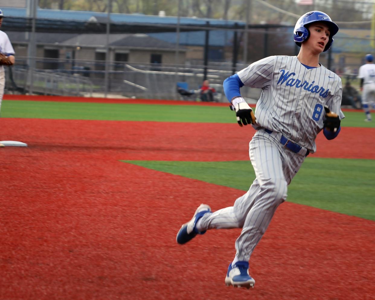 Buckeye Trail's Tyeson Mercer (8) runs to third during the Warriors versus Bobcats baseball game Wednesday evening at Buckeye Trail High School. Mercer collected the pitching win in the Warriors 4-1 victory in his first starting assignment of the season.