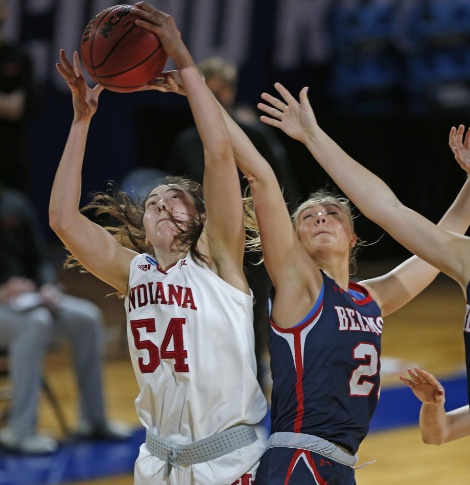 Indiana forward MacKenzie Holmes (54) grabs a rebound next to Belmont forward Conley China (20) during the first half of a college basketball game in the second round of the NCAA women's tournament at Greehey Arena in San Antonio on Wednesday, March 24, 2021. (AP Photo/Ronald Cortes)
