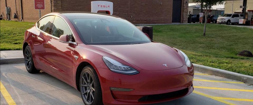 Tesla vehicle in red