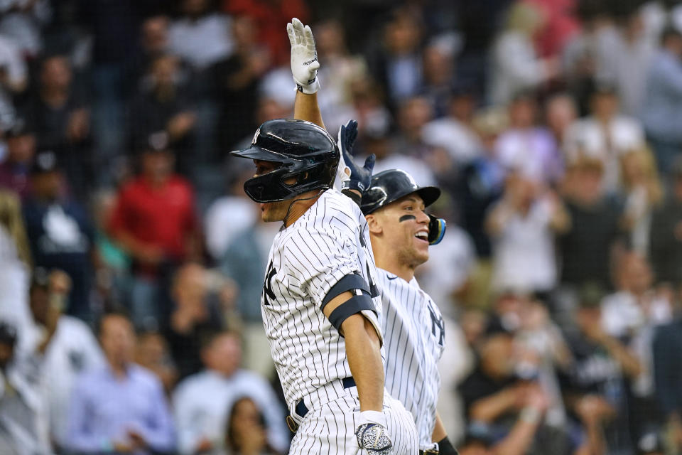 New York Yankees' Giancarlo Stanton, left, celebrates with Aaron Judge after Stanton hit a three-run home run against the Houston Astros during the first inning of a baseball game Thursday, June 23, 2022, in New York. (AP Photo/Frank Franklin II)