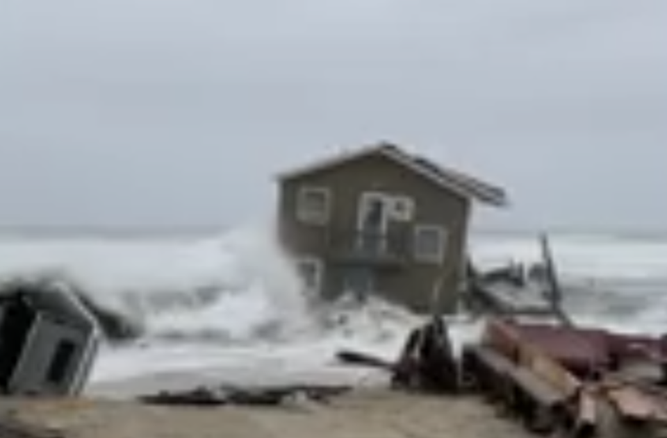 A North Carolina beach house was swept away by the waves this week in the state’s outer banks (AP)