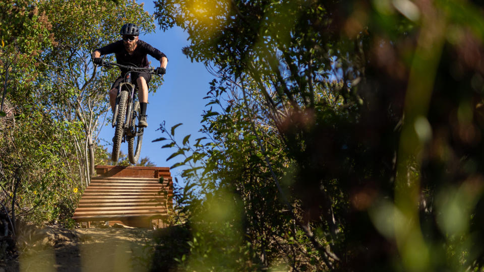 Giant Stance bike being ridden off a drop