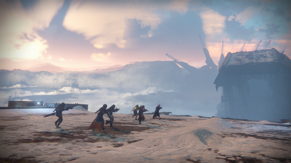 Six characters navigating a desert environment in Destiny 2.