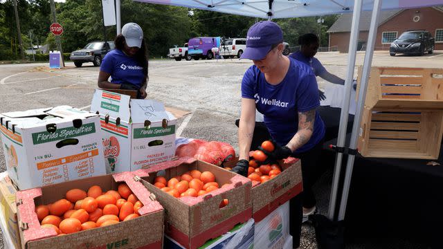 <p>Wellstar</p> Team members participate in a Wellstar on Wheels event on May 28 in Atlanta.