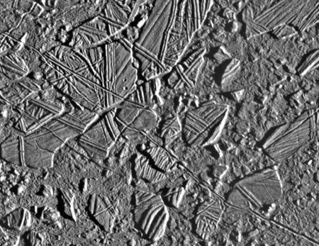 On Europa, "chaos terrains" consist of regions where the icy surface appears to have broken apart, the broken pieces moved around, and then those pieces froze back together.