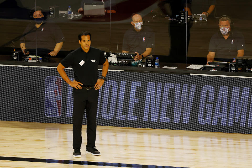 Miami Heat head coach Erik Spoelstra watches during the first half of an NBA basketball game against the Denver Nuggets, Saturday, Aug. 1, 2020, in Lake Buena Vista, Fla. (Kevin C. Cox/Pool Photo via AP)