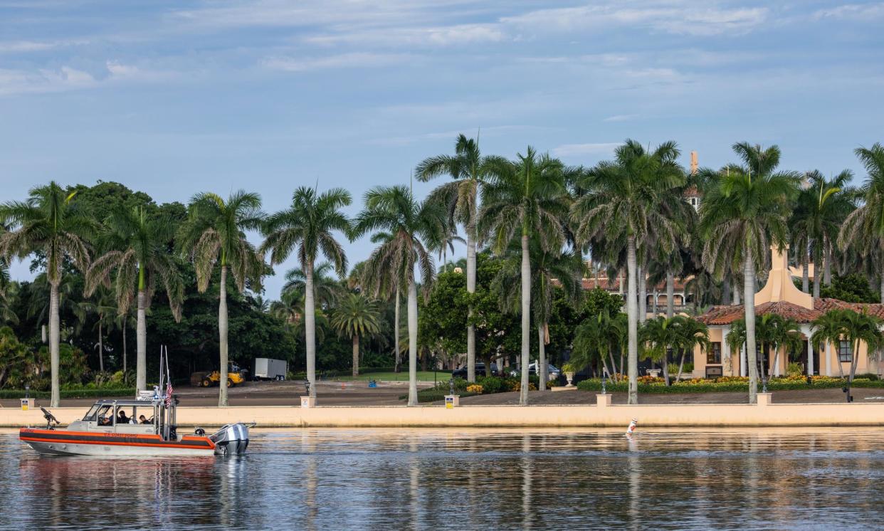 <span>Coast Guard officers guard the waterfront of Donald Trump’s Mar-a-Lago club in Palm Beach, Florida.</span><span>Photograph: Cristóbal Herrera/EPA</span>