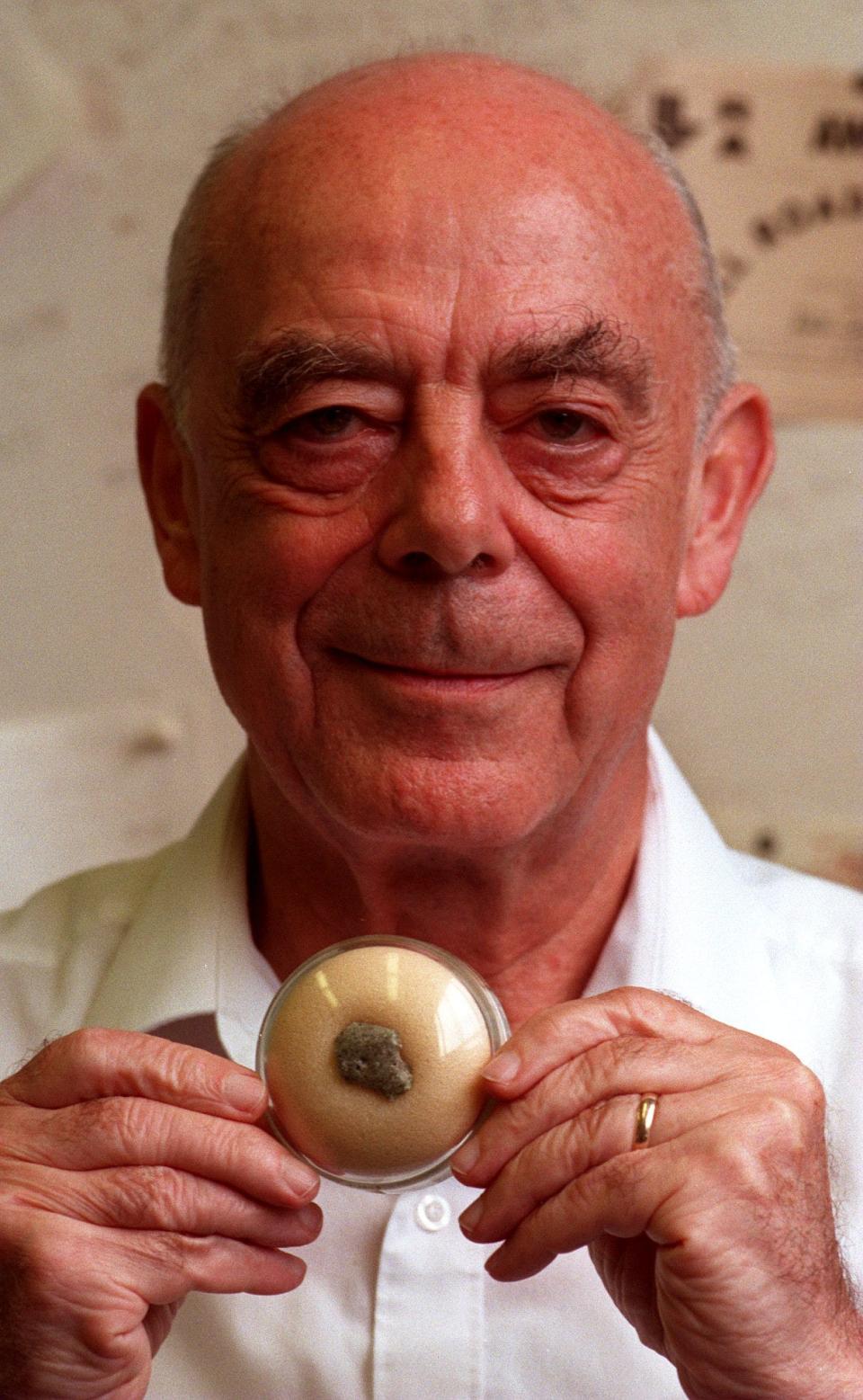 Raymond Sheline, FSU Professor, with a piece of fused sand from the first nuclear blast. Sheline was part of the Manhattan Project.